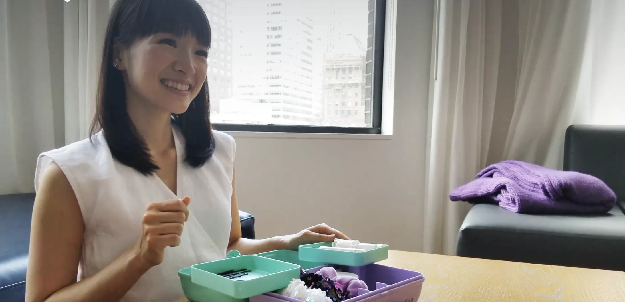 marie kondo showing how she'd organize beauty products