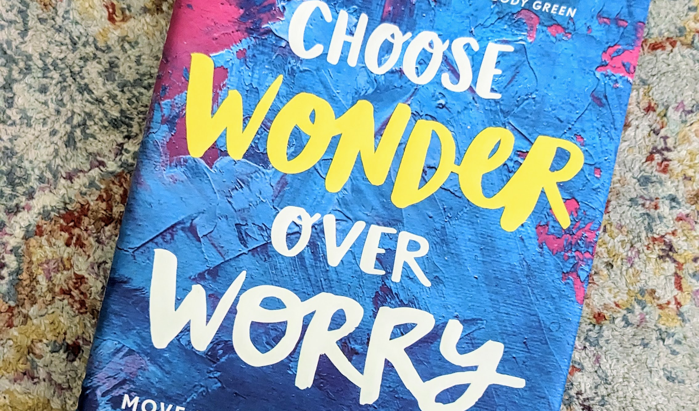 Blue and purple 'Choose Wonder Over Worry' book, which helped me understand what makes people judgy