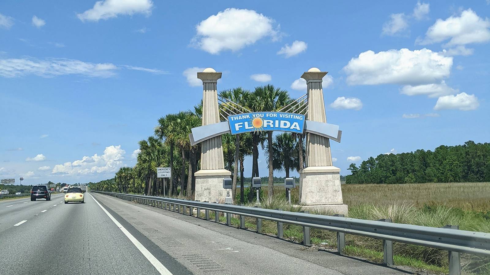 Passing the "leaving florida" sign while testing best kids travel gear for road trips