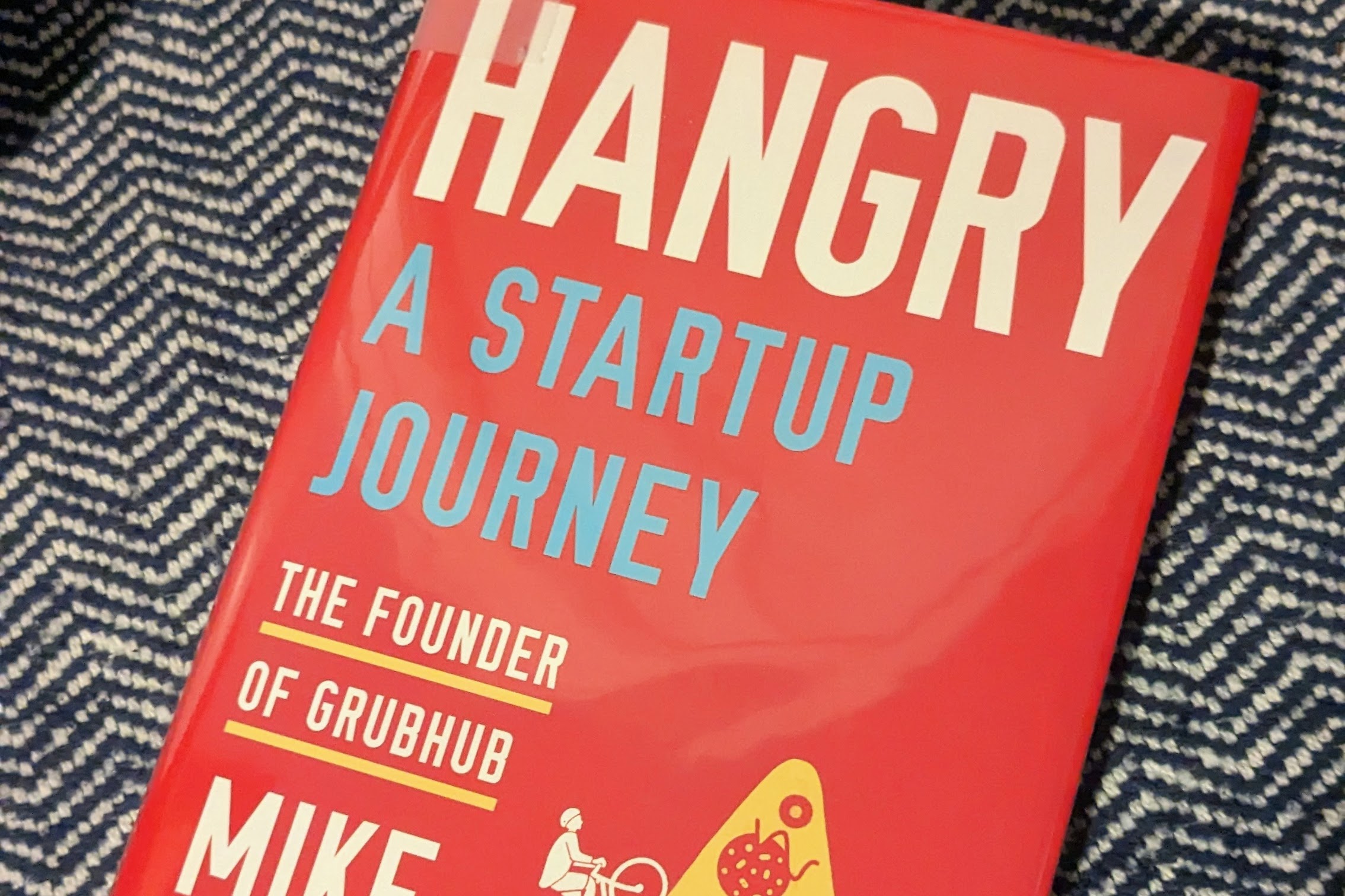 Hangry: A Startup Journey hardcover book in red, white, yellow and blue