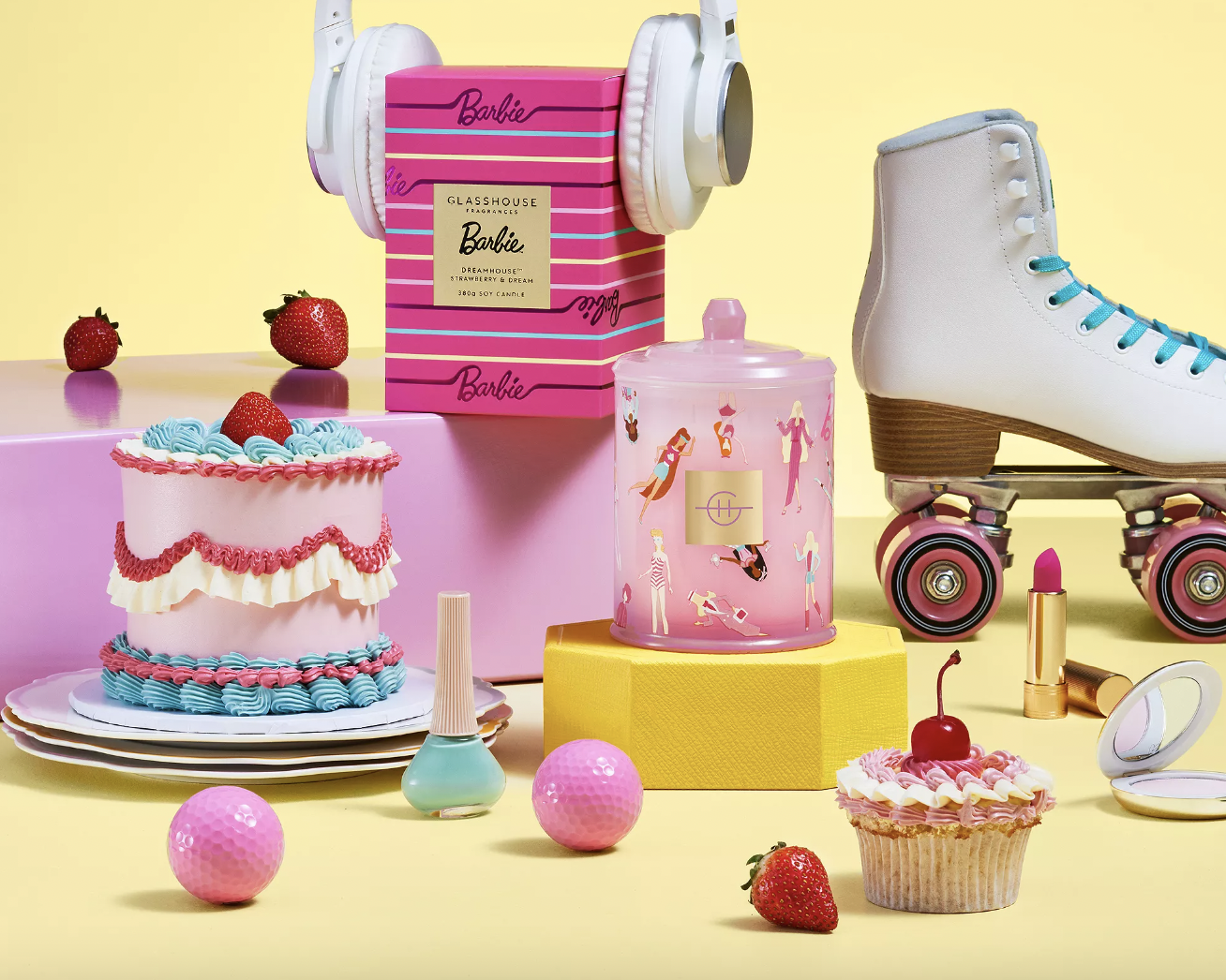 barbie candles next to skates and cakes