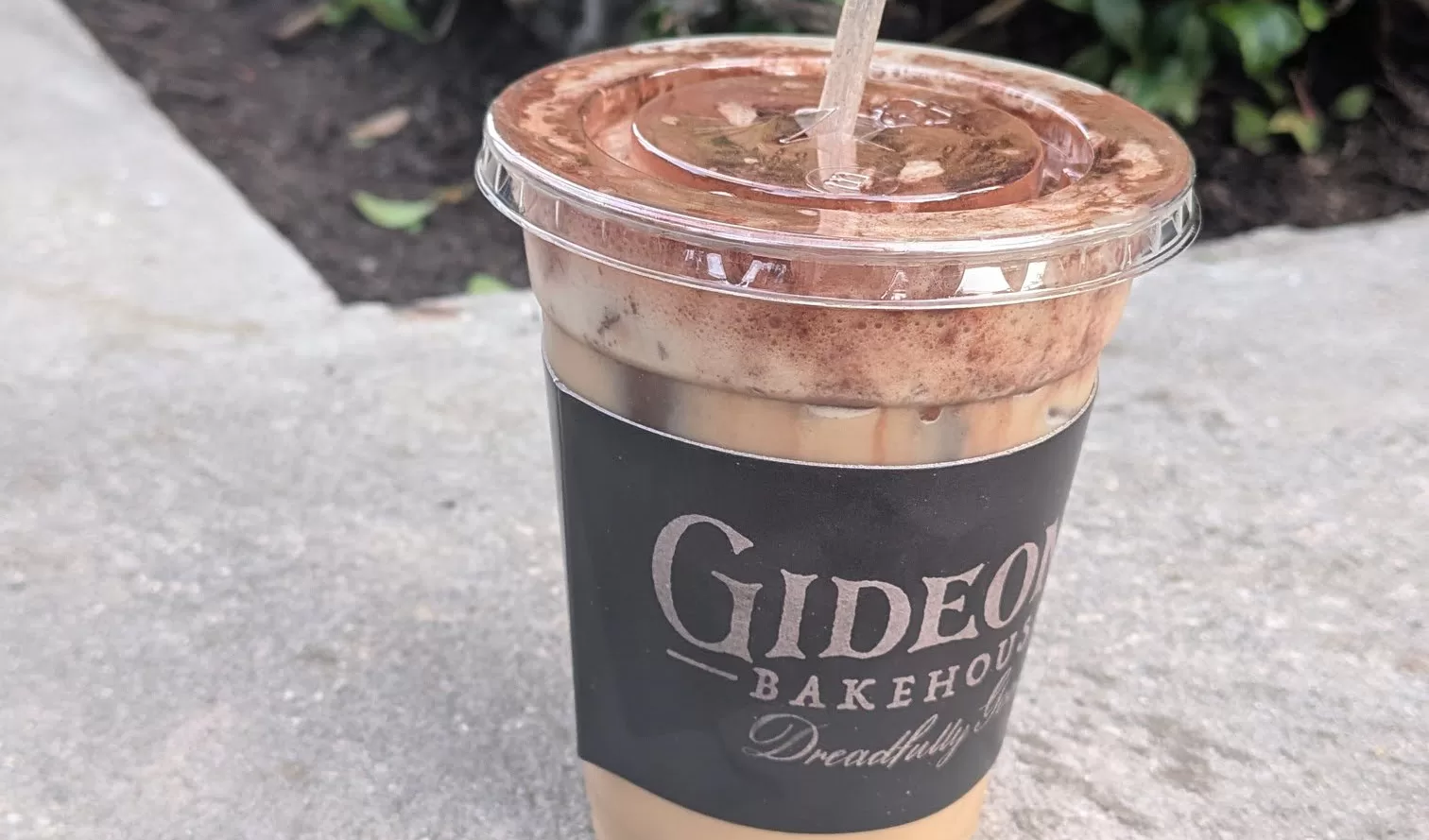 gideon's bakehouse peanut butter cold brew, close up to show swirls of cocoa powder in drink